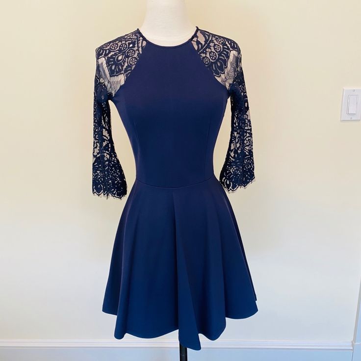 Deep Navy Blue Skater Dress With Open Back & Sleeve Lace Detail. Nwt. Navy Long Sleeve Midi Dress For Party, Navy Fitted Mini Dress For Night Out, Navy Dress For Fall Party, Blue A-line Mini Dress For Fall, Blue Fitted Mini Dress For Brunch, Fitted Blue Mini Dress For Brunch, Chic Navy Fitted Mini Dress, Navy Fitted Dress For Date Night, Blue Dresses For Fall Brunch