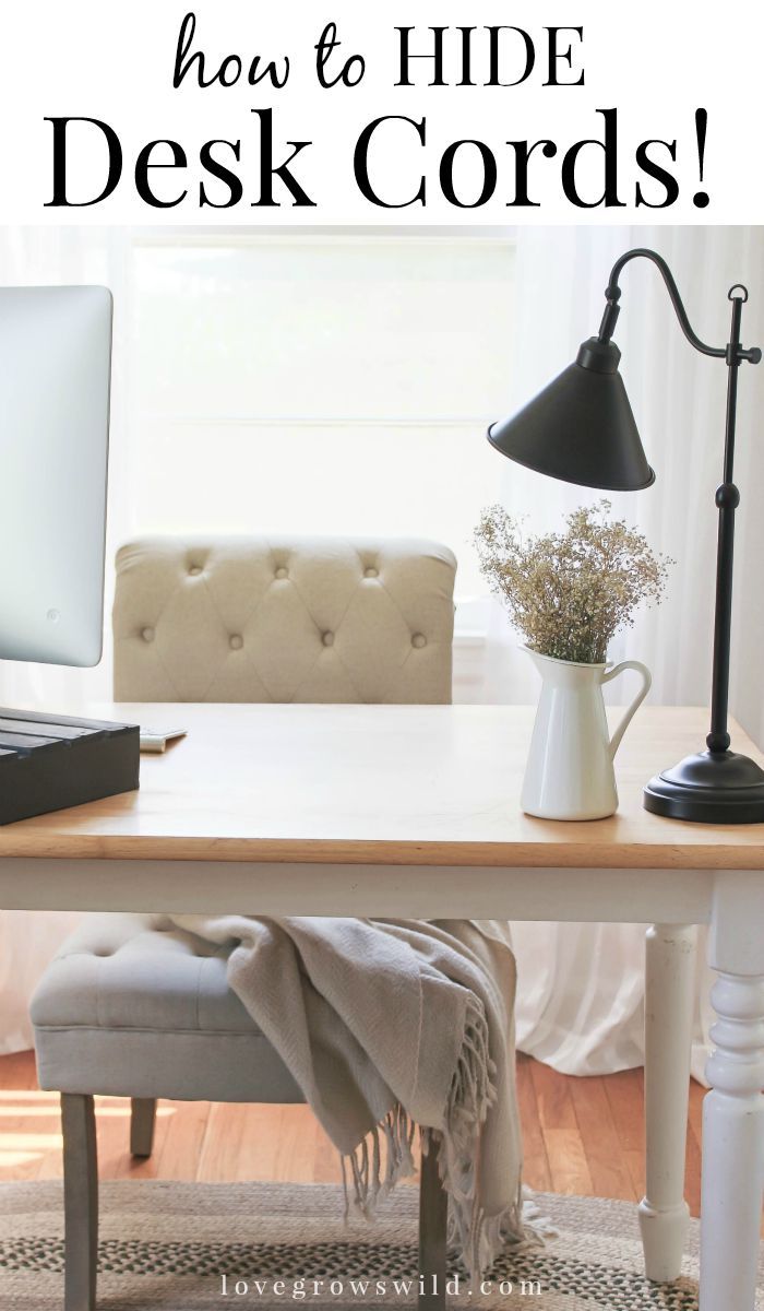 a desk with a chair and a computer on it that says how to hide desk cords