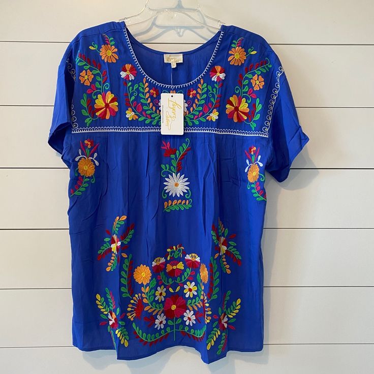 Nwt Boutique Embroidered Top, Large Spring Beach Embroidered Blue Top, Spring Blue Embroidered Top For Beach, Blue Embroidered Top For Spring Beach Occasion, Blue Casual Embroidered Top For Vacation, Blue Short Sleeve Embroidered Top For Spring, Spring Blue Embroidered Top With Floral Details, Blue Embroidered Short Sleeve Top For Spring, Blue Tops With Geometric Embroidery For Spring, Casual Blue Embroidered Top For Vacation