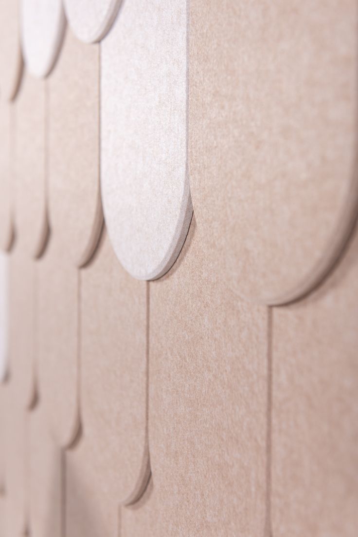 the wall is made up of different shapes and sizes, including curved lines on each side