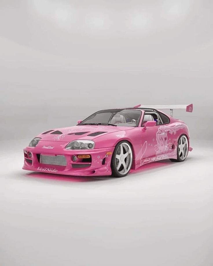 a pink sports car is shown in this image