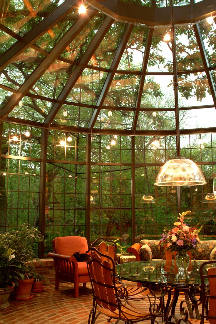 the inside of a glass house with lots of windows