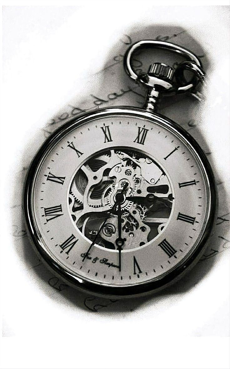 a black and white photo of a pocket watch