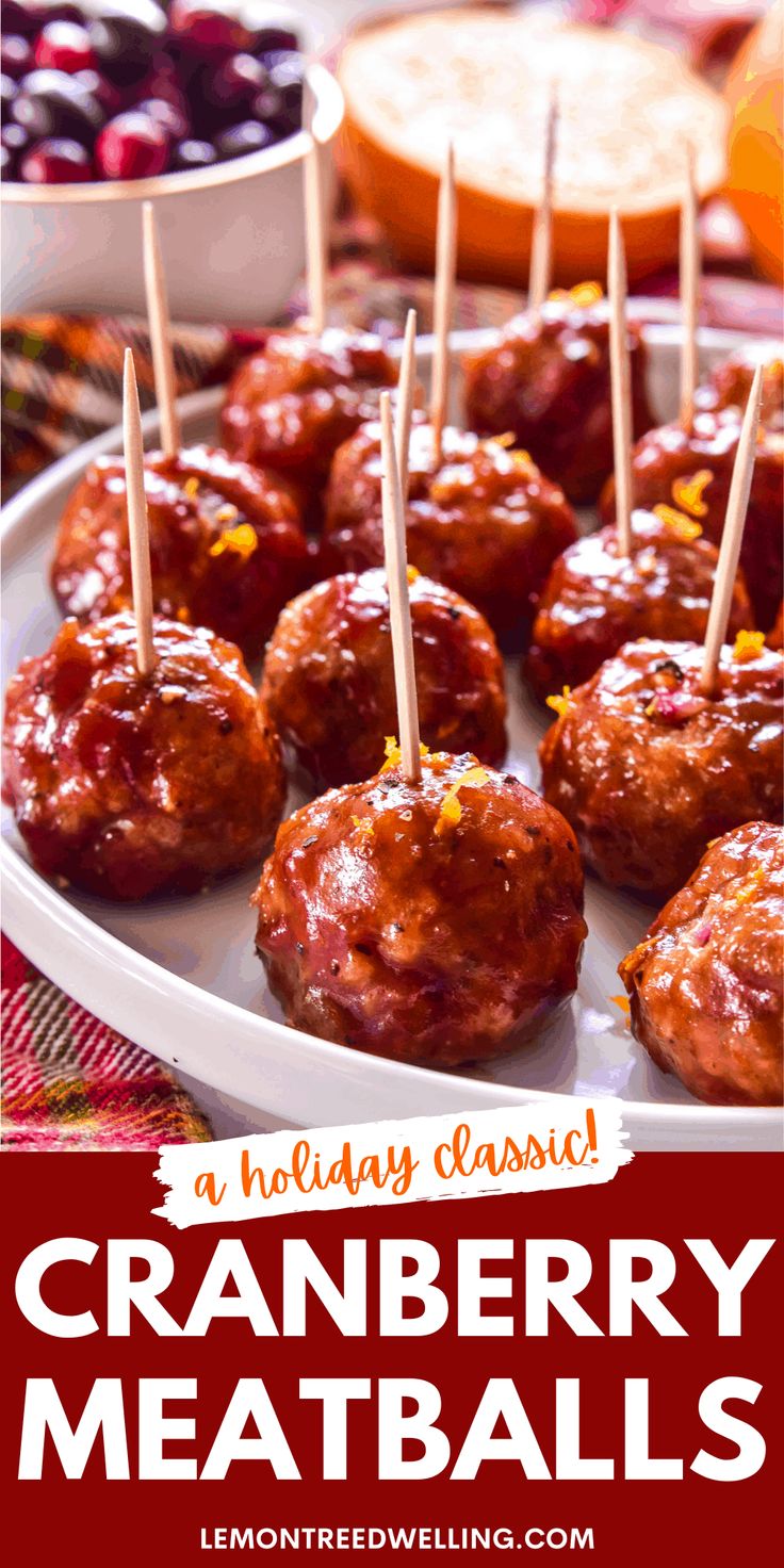 cranberry meatballs with toothpicks in them on a white plate