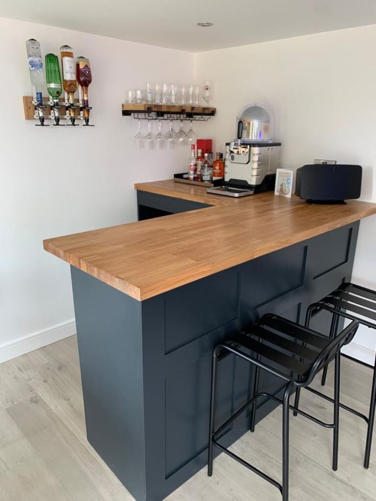 a bar with three stools next to it