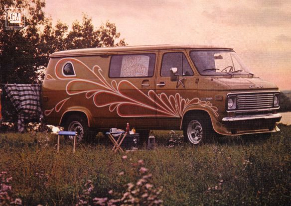 an old van is parked in the grass