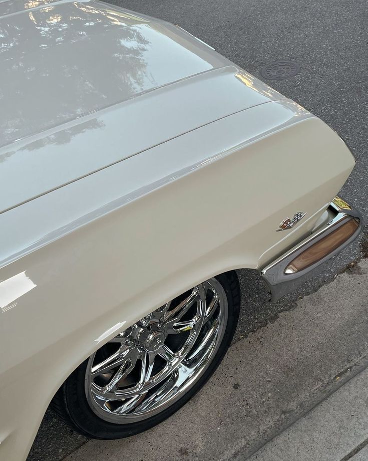 an old car parked on the side of the road