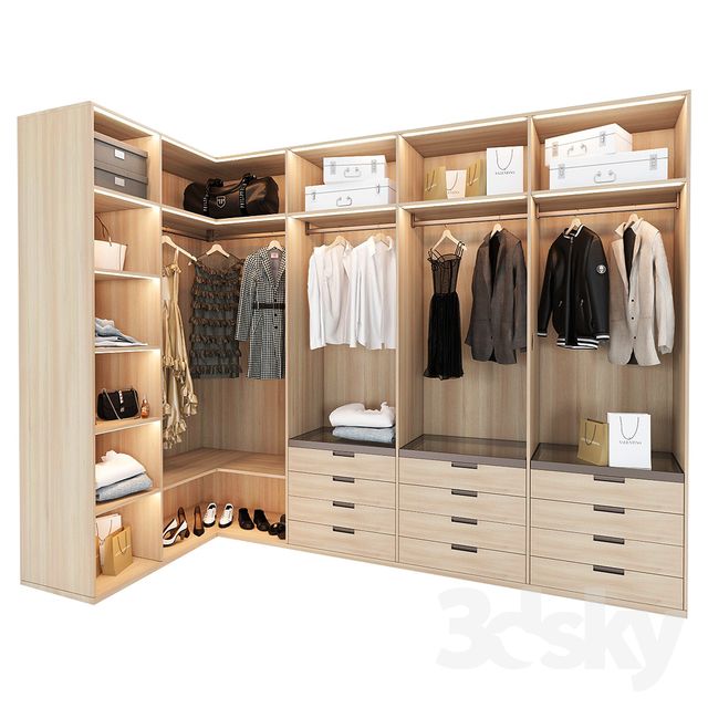 an open closet with clothes and shoes on the shelves