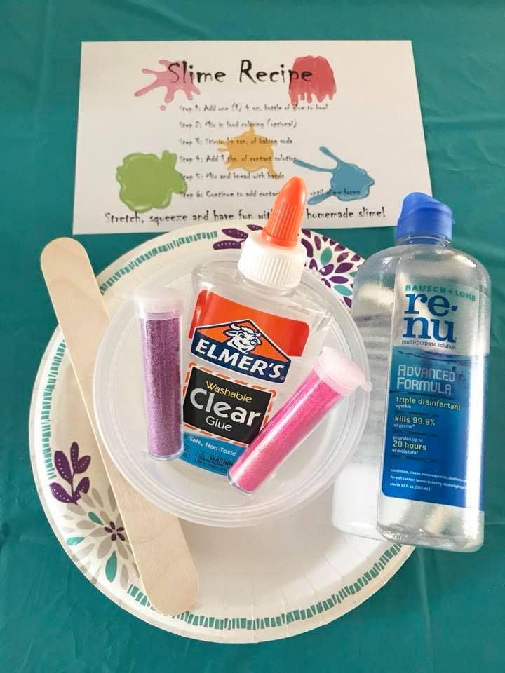 a plate with some toothpaste, glue and other items sitting on top of it