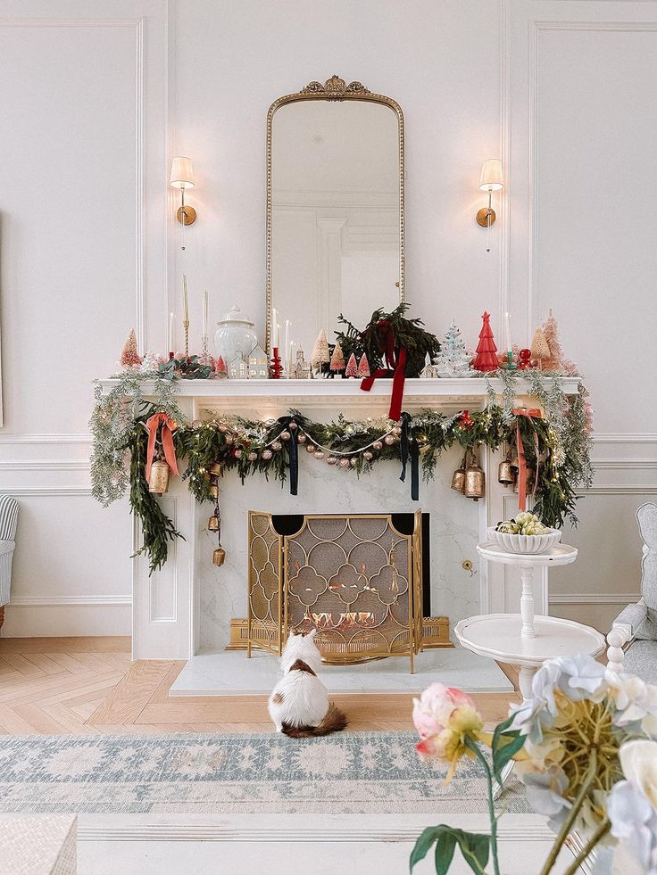 a living room with a fireplace decorated for christmas