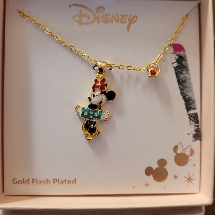 the disney mickey mouse necklace is in its box