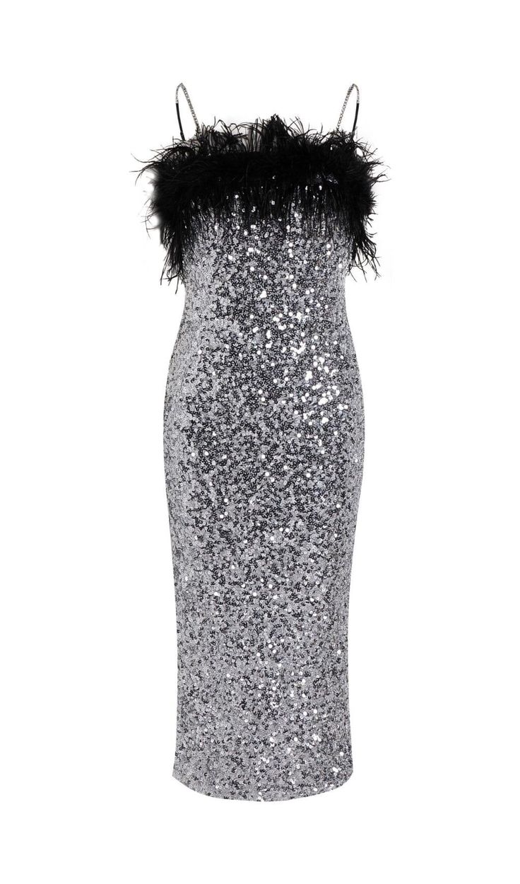 a silver sequin dress with black feathers on the shoulders and shoulder, in front of a white background