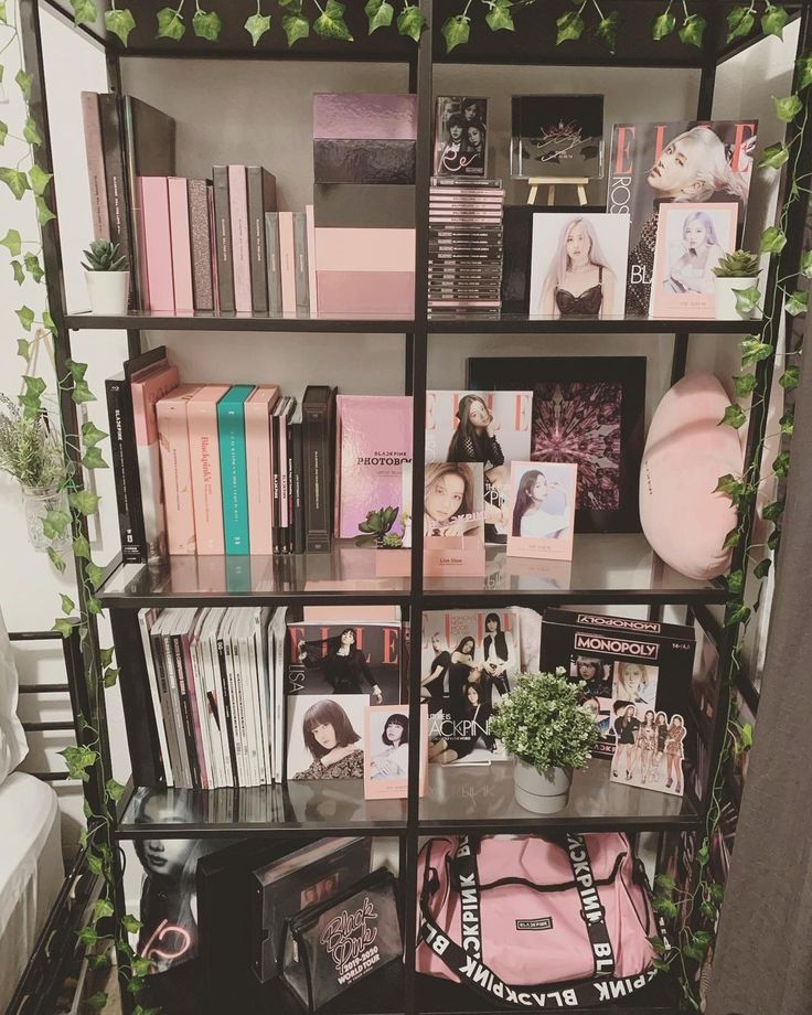 a book shelf filled with books and pictures