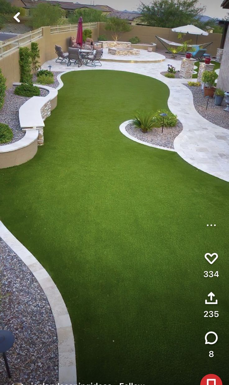 a backyard with artificial grass and an arrow pointing to the left in front of it