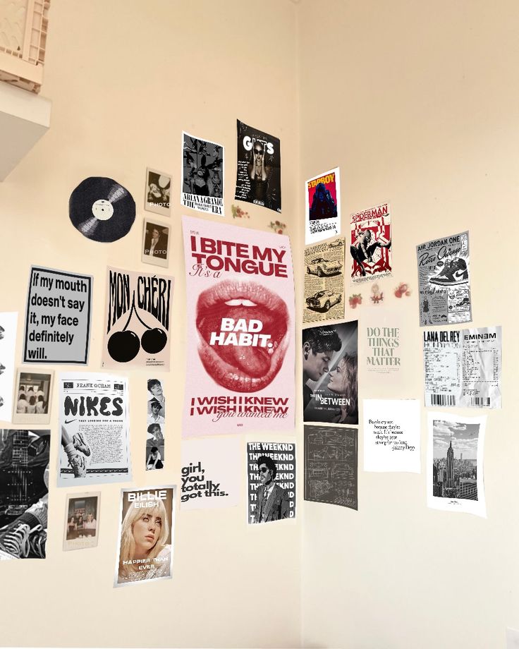 the wall is covered with posters and other items from various eras, including vinyl records