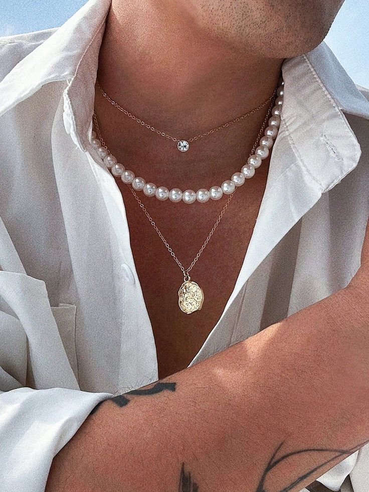 Stunning men's necklace set featuring a 3D diamond and pearl design. Perfect for a special occasion or everyday wear.

#mensjewelry #necklace #diamond #pearl #giftforhim https://whispers-in-the-wind.com/discover-the-latest-mens-accessory-trends-for-2024/?vintage-bohemian-vacation-style-metal-mermaid-tail-shell-pendant-necklace Body Necklace Chain, Pearl And Diamond Necklace, Mens Jewelry Necklace, Coin Pendant Necklace, Round Pendant Necklace, Estilo Hip Hop, Unique Jewelry Designs, Mens Gold, Pearl Pendant Necklace