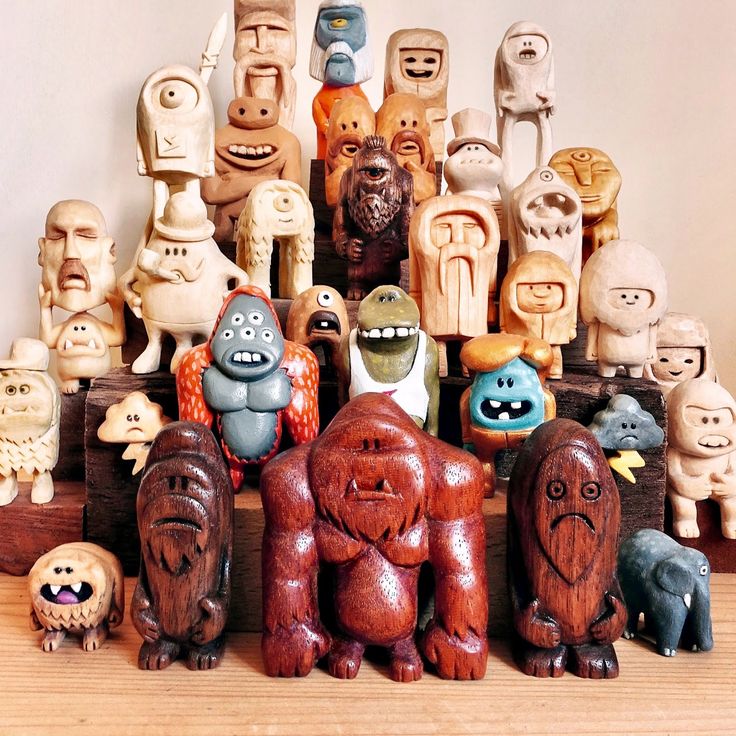 there are many wooden toys that look like people in the form of humans and dogs