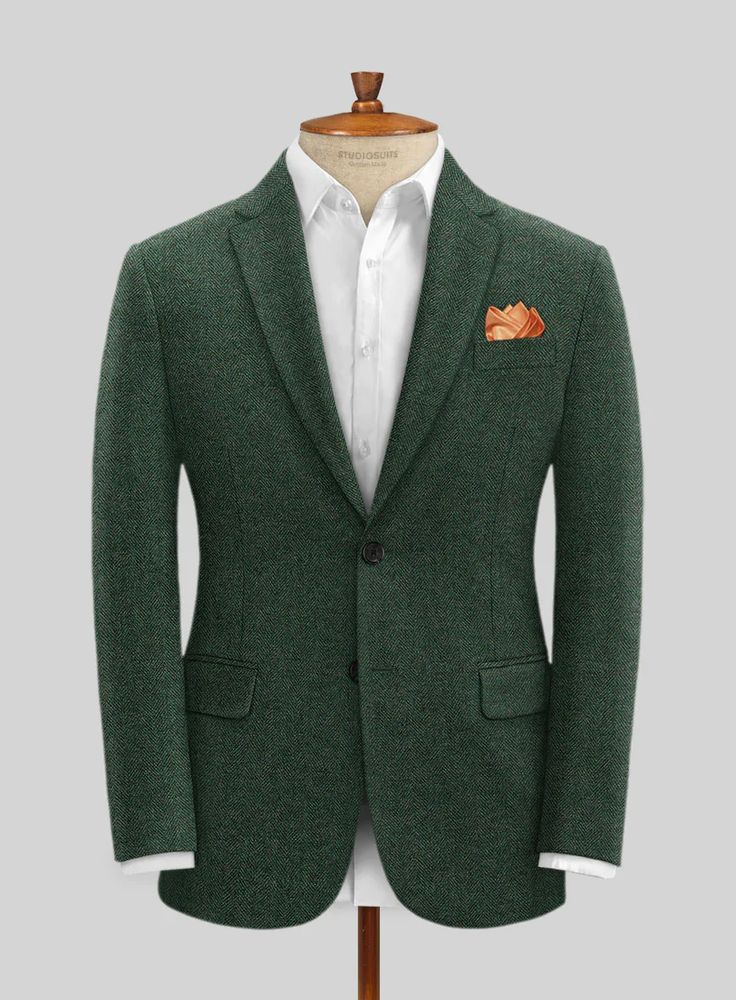 Make an entrance in our Bottle Green Herringbone Tweed Jacket that isn't afraid to let its true colors fly. Crafted from wool, the jacket features a herringbone pattern that develops a bit of texture and mystique, while its bottle green color places itself in the super suave category, making it ideal for a distinctive Tailored Green Winter Suit, Green Notch Lapel Suit For Winter, Classic Green Winter Suits, Green Tailored Tweed Jacket With Notch Lapel, Tailored Green Tweed Jacket For Business, Green Wool Suits For Winter, Semi-formal Green Wool Tweed Jacket, Green Wool Winter Suits, Fitted Green Single-breasted Tweed Jacket