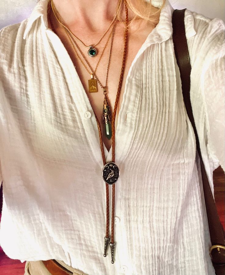 Layered necklaces with crystal & bolo tie gold jewelry Women’s Bolo Tie, Women’s Bolo Tie Fashion, How To Style Bolo Tie, How To Style A Bolo Tie Women, Womens Bolo Tie Outfit, Styling Bolo Tie Women, Bolo Outfits Women, Women Bolo Tie, Women Bolo Tie Outfit