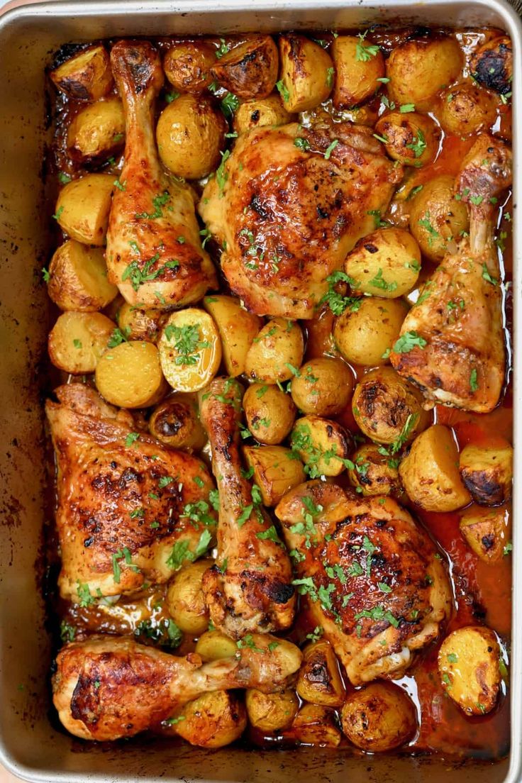 chicken, potatoes and parsley in a roasting pan