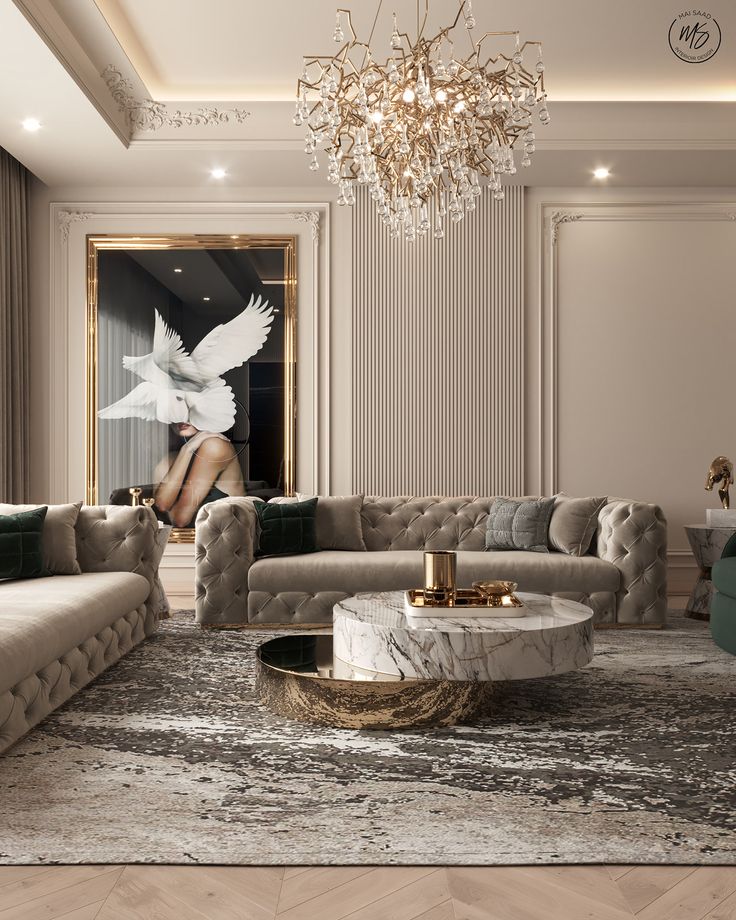 a living room with couches and a chandelier