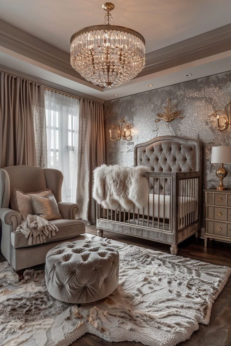 a baby's room with a crib, chair and chandelier