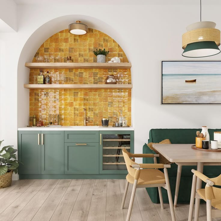 a kitchen with green cabinets and wooden flooring next to a wall mounted wine rack