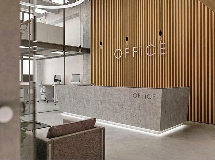 an office lobby with wooden walls and chairs