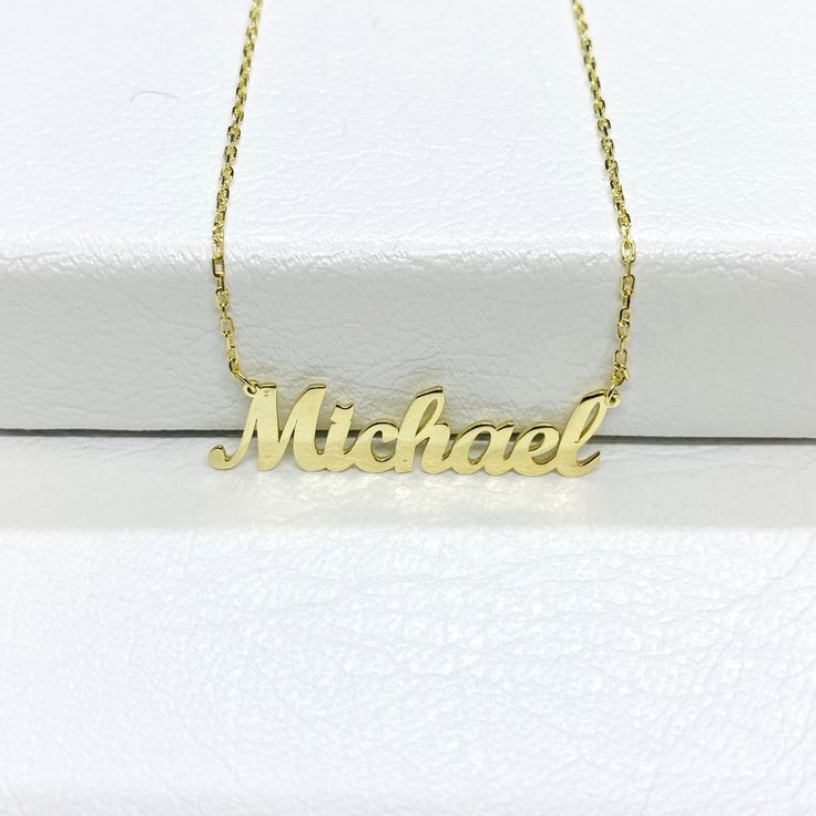 "- Name necklace is made with high quality 14K real solid gold. - You can order dainty name necklace in white gold or yellow gold. - 14K gold dainty name necklace, the perfect combination of elegance, and sophistication. 14K personalized nameplate necklace is the ideal accessory for any occasion, from everyday wear to special events. - Featuring a stunning Dainty Customized jewelry in 14K solid gold, Personalized jewelry is sure to catch the eye of anyone who sees it. The delicate gold chain name necklace adds a touch of elegance and femininity to the design, making it the perfect necklace for women of all ages. - 14K solid gold custom name necklace is not only a beautiful piece of personalized jewelry, but it is also the perfect gift for any special occasion. Whether you're looking to sur Custom Yellow Gold Names Necklace For Gifts, Classic Nameplate Necklace For Birthday, Gold Custom Necklace With Names For Birthday Gift, Custom Gold Necklace With Names For Birthday Gift, Custom Gold Necklace With Names For Birthday, Nameplate Necklace With Hallmarks For Birthday, Classic Yellow Gold Name Necklace For Birthday Gift, Customized 14k Gold Name Necklace For Birthday, Customizable Yellow Gold Name Necklace For Birthday