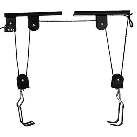 two black metal objects hanging from hooks on a white background with clipping for text