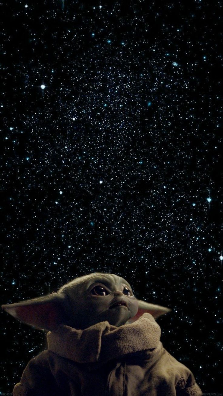 the child yoda is looking up at the stars