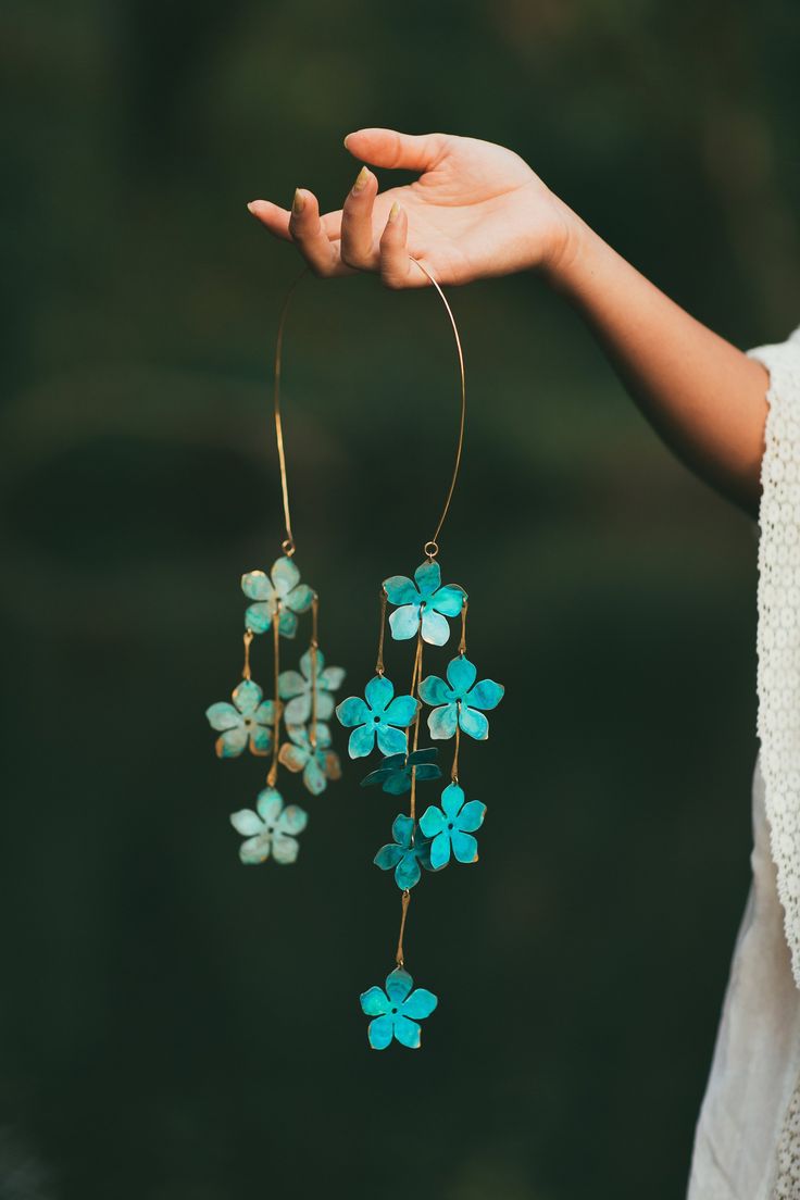 A dramatic cascade of verdant blossoms float from a hand hammered band for a stunning dose of bohemian glamour. All brass construction with natural verdigris patina. Nickel and lead free. Bohemian Green Jewelry With Flower Decoration, Bohemian Glamour, Wire Jigs, Flowers Composition, Metal Art Jewelry, Beach Jewelry Boho, Bold Statement Jewelry, Headpiece Diy, Fairy Accessories