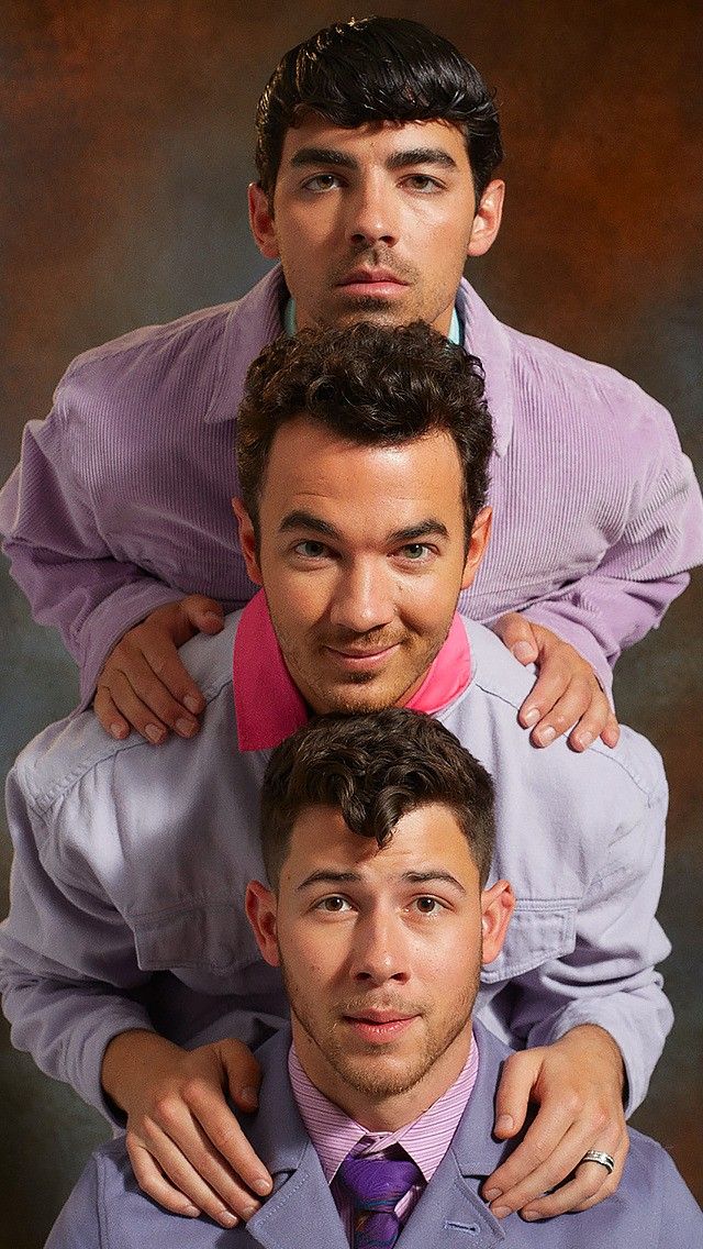 three young men are posing for the camera