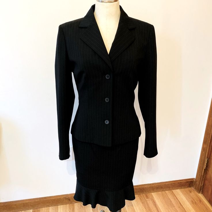 Le Suit- Black And White Pin Strip Skirt Suit. Three Button Down Blazer Suit Jacket And Matching Skirt With Ruffle Hem Line That Zips In The Back. This Suit Is Absolutely Beautiful And In Excellent Brand New Condition. Pet Free And Smoke Free Home Size 6 Measurements: Blazer- Shoulder To Sleeve Hem: 24 Inches Skirt - Waistline Width: 14 1/2 Inches Length: 25 Inches Black Skirt Suit For Fall Office Wear, Black Skirt Suit For Office Wear In Fall, Classic Skirt Suit With Buttons For Career, Winter Office Skirt Suit With Button Closure, Classic Winter Skirt Suit For Career, Fitted Skirt Suit With Button Closure For Work, Black Fall Office Skirt Suit, Black Skirt Suit For Office In Fall, Black Fall Skirt Suit For Office