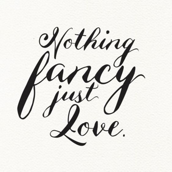 the words nothing fancy just love written in cursive writing on white paper with black ink