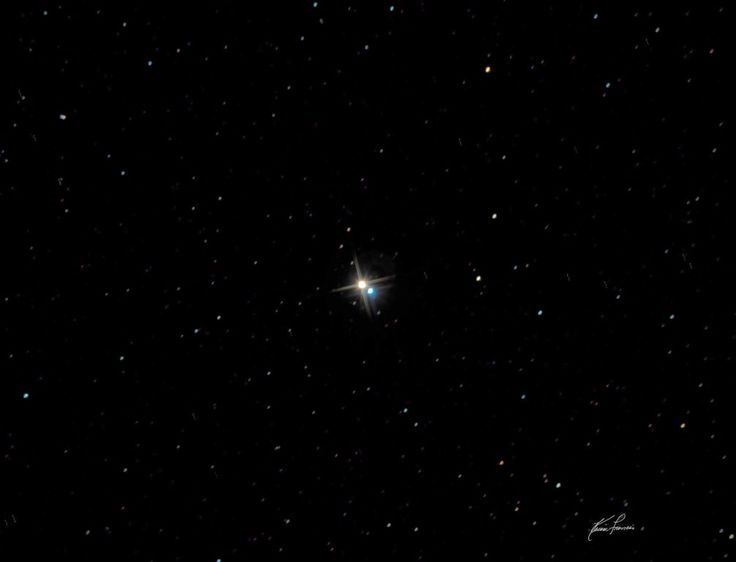 the bright star is shining brightly in the dark sky