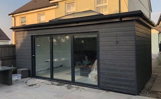 a small house with sliding glass doors on the outside