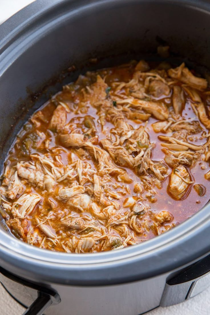 the food is being cooked in the slow cooker