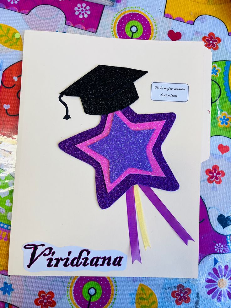 a card with a graduation cap and star on it