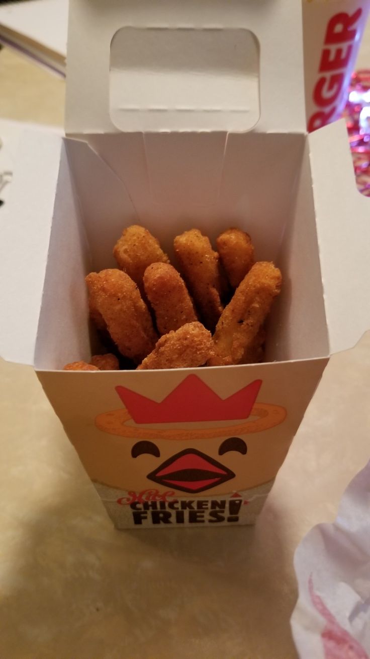 a box filled with tater tots sitting on top of a table