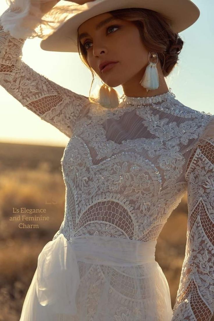 a woman wearing a white dress and hat