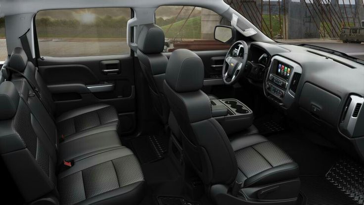 the interior of a truck with black leather seats