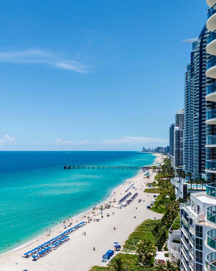 an aerial view of the beach and ocean in miami