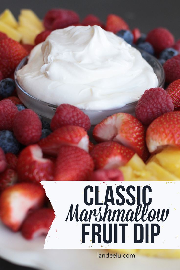 a close up of fruit on a plate with the words classic marshmallow fruit dip