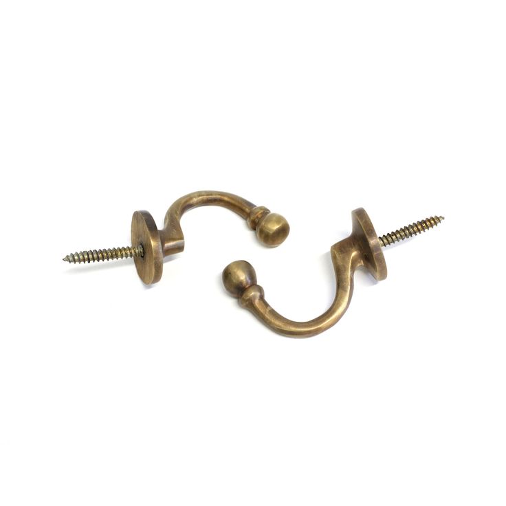 two screws are attached to the end of a hook and nails on a white background