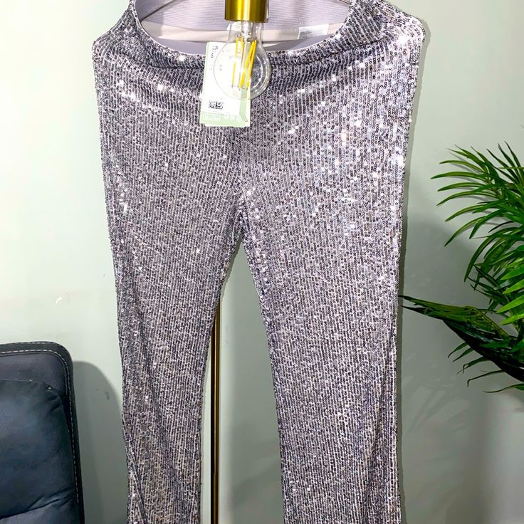 H&M Brand New Sequin Pants Perfect Condition All Pictures & Videos Are An Accurate Representation Of The Item. Please Thoroughly Examine All Pictures And Videos Prior To Purchasing :) Shiny Stretch Bottoms For Party Season, Metallic Stretch Pants With Sequins, Stretch Metallic Pants With Sequins, Metallic Sequined Stretch Pants, Metallic Sequin Stretch Pants, Glamorous Metallic Stretch Pants, Silver Sequin Pants For Party Season, Silver Stretch Bottoms For Spring, Silver Sequined Pants For Night Out