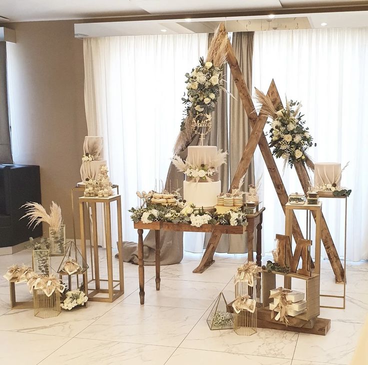 a room filled with tables and chairs covered in white flowers