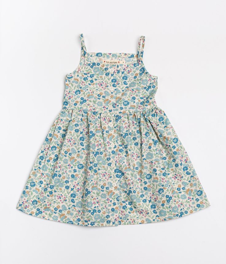 The Heather Dress in Blueberry Floral - Pips and Poppy Cotton A-line Sundress For Daywear, Cotton A-line Sundress For Garden Party, Cotton A-line Dress With Buttons, Cotton A-line Sundress, Summer Cotton A-line Floral Dress, Cotton A-line Dresses With Button Closure, Sleeveless Dress With Button Closure For Garden Party, Summer Cotton Sundress With Buttons, Cotton Smocked Sundress For Daywear