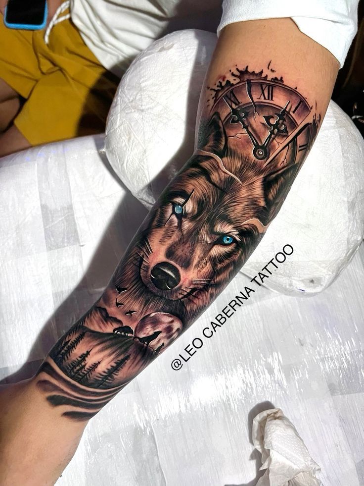 a man's arm with a wolf and clock tattoo on the left side of his arm