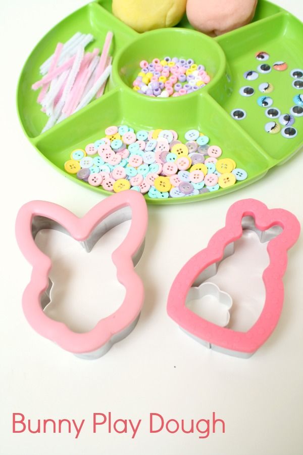 bunny play dough and cupcake cutters on a plate with the words bunny play dough